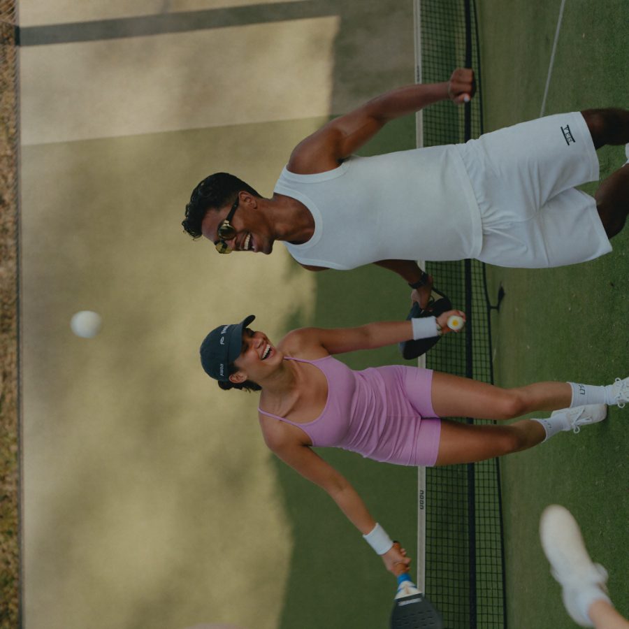 Two friends playing padel